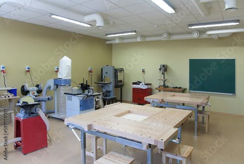 School classroom set up for a technical or practical course. Woodworking and light engineering. Clamps, machines and work surfaces. photo