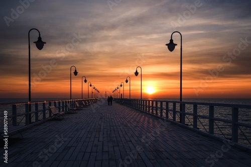 Beautiful sunrise over the Polish sea. Popular pier on the Baltic Sea at sunrise. Photo taken in Gdynia  Poland.