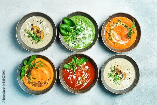 Dietary cream soups from vegetables. Colored soups in a bowl. Healthy food concept. Advertising photo.
