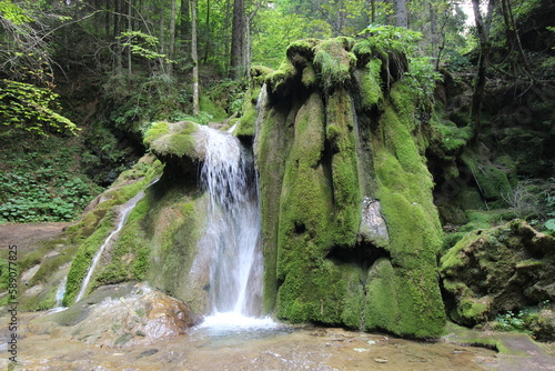 River stream waterfall in forest landscape. Stream on river Miljacka, Vrelo Miljacke photo