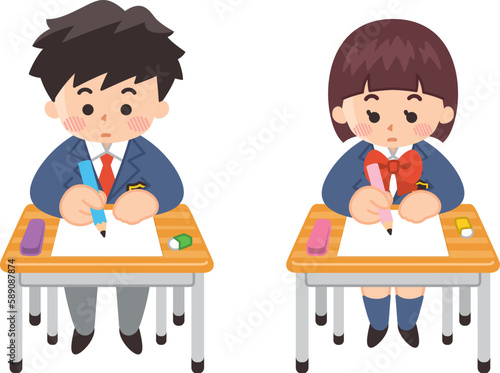 学校の机で勉強する中高生の男女