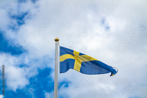National flag of Sweden waving in the wind. photo