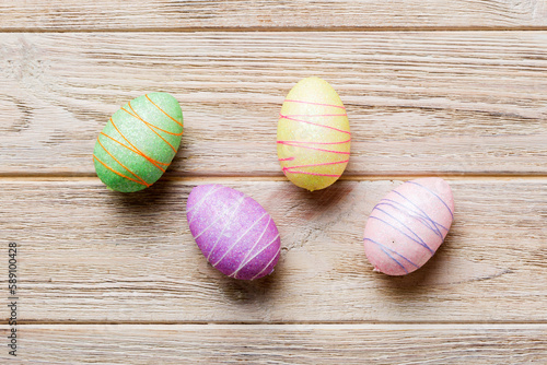 decorative easter eggs on colored background. easter eggs collection top view with copy space