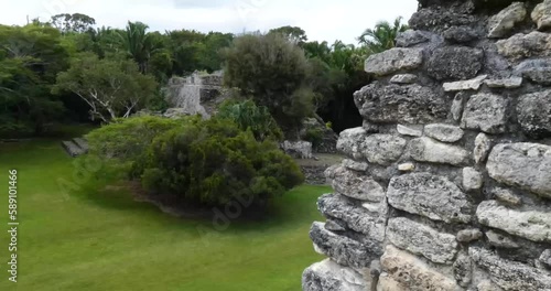 Wall of the Acropolis pan to Temple of the King, Kohunlich mayan site - Quintana Roo, Mexico photo