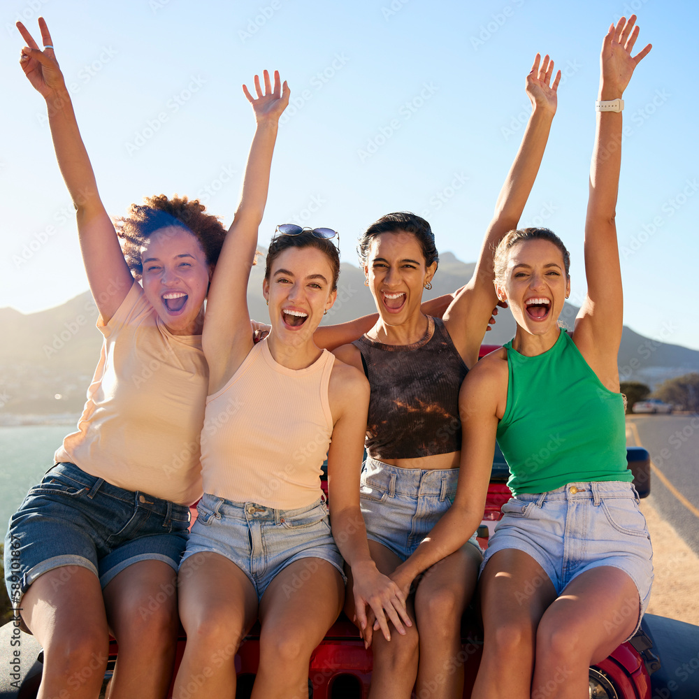 Portrait Of Laughing Female Friends Sitting On Hood Of Open Top Car On Road Trip Portrait Of Laughing Female Friends Sitting On Hood Of Open Top Car On Road Trip