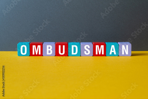 Ombudsman - word concept on cubes photo