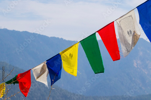 Tibetan prayer flags flapping in the wind photo