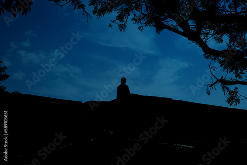 silhouette of a person in the mountains
