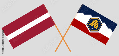 Crossed flags of Latvia and The State of Utah. Official colors. Correct proportion photo