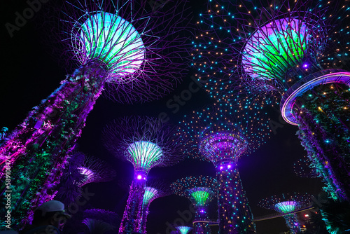 Futuristic wide angle video of the light show during the night from Garden by the Bay landmark in Singapore, 2023.