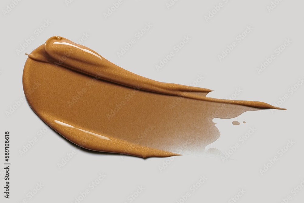 Texture of smudge cosmetic bb or cc cream dark colored foundation liquid background isolated on gray Texture of smudge cosmetic bb or cc cream dark colored foundation liquid background isolated on gray