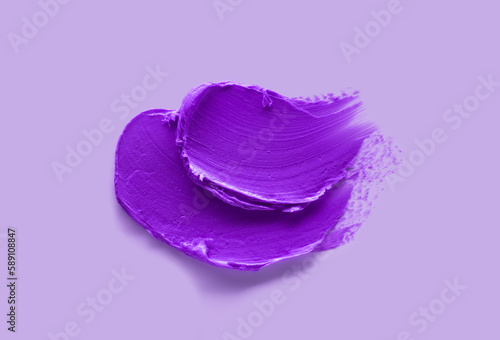 Purple creamy eye shadower eye liner matte. Lip stick. Isolated on lavender background photo