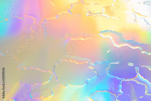 Blurred defocused abstract iridescent foil wallpaper texture. Holographic soft pastel colors backdrop. Colorful rainbow gradient poster, banner background. Minimal liquid owerflow, unicorn aesthetic. photo