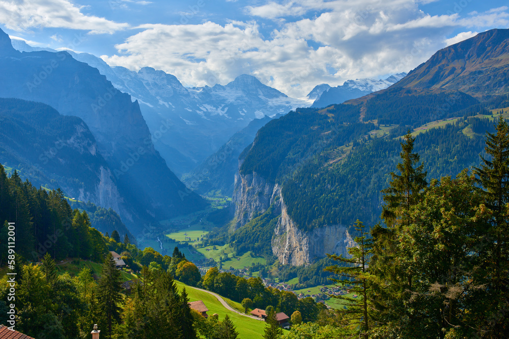 Mountain landscape with cliffs in the valley. View from Wengen village in Lauterbrunnen in Switzerland.