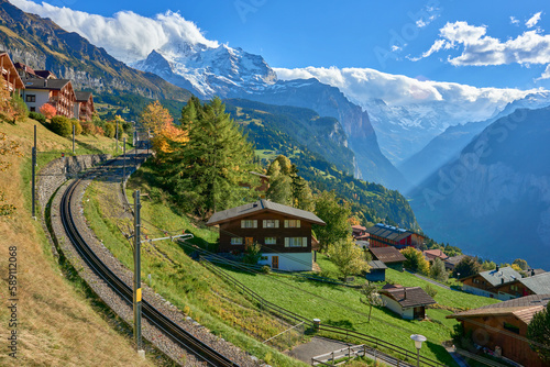 Autumn view from Swiss alpine village of Wengen to the Lauterbrunnen valley and the mountain railway.