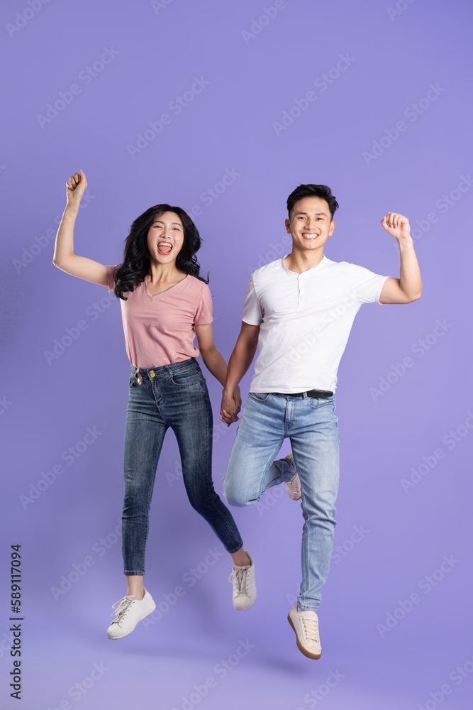 full body image of asian couple posing on purple background full body image of asian couple posing on purple background