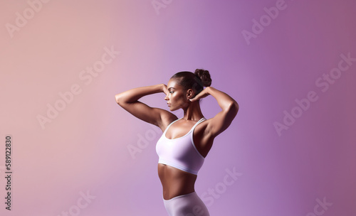 A fictional person. Confident fitness model posing against a one-color background