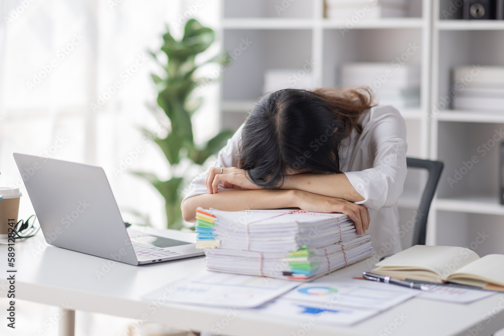 Asian women are stressed or has sore throat at office while working on laptop, Tired asian businesswoman with headache at office, feeling sick at work, copy space Asian women are stressed or has sore throat at office while working on laptop, Tired asian businesswoman with headache at office, feeling sick at work, copy space