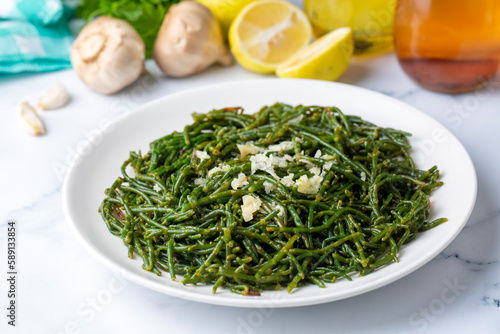 Sea beans and green meze on table. Turkish name; Deniz borulcesi mezesi photo