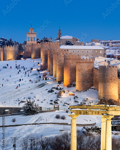 Majestic ancient fortress in snowy town photo