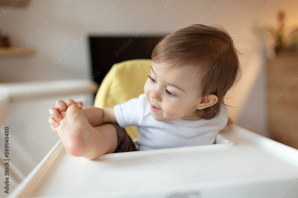 Adorable child in the highchair Adorable child in the highchair