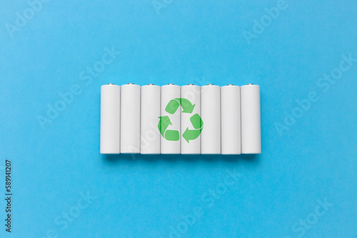 Set of recycling batteries on blue background photo