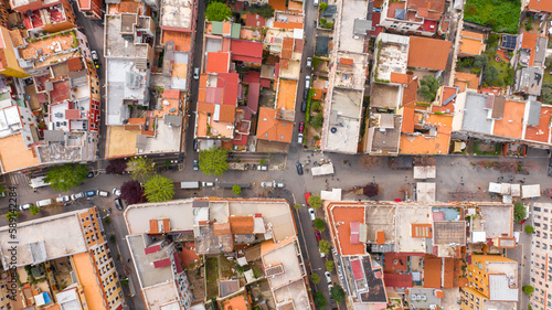 Fototapeta Naklejka Na Ścianę i Meble -  Perpendicular aerial view of the main street of the Pigneto district in Rome, Italy. It is a pedestrian street in a residential area with many buildings.