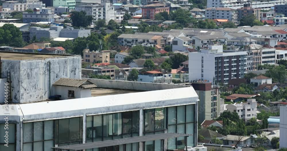 City Office Building in Bangkok, Thailand. Panning Up Shot Revealing City View of Apartments and Other Buildings. City Office Building in Bangkok, Thailand. Panning Up Shot Revealing City View of Apartments and Other Buildings.