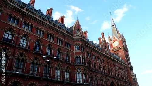 Saint Pancras Station and its clock tower in a sunny day, London. Static shot photo