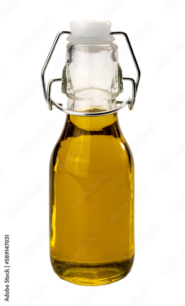 Extra virgin olive oil in small bottle with hermetic mechanical cap, isolated Extra virgin olive oil in small bottle with hermetic mechanical cap, isolated