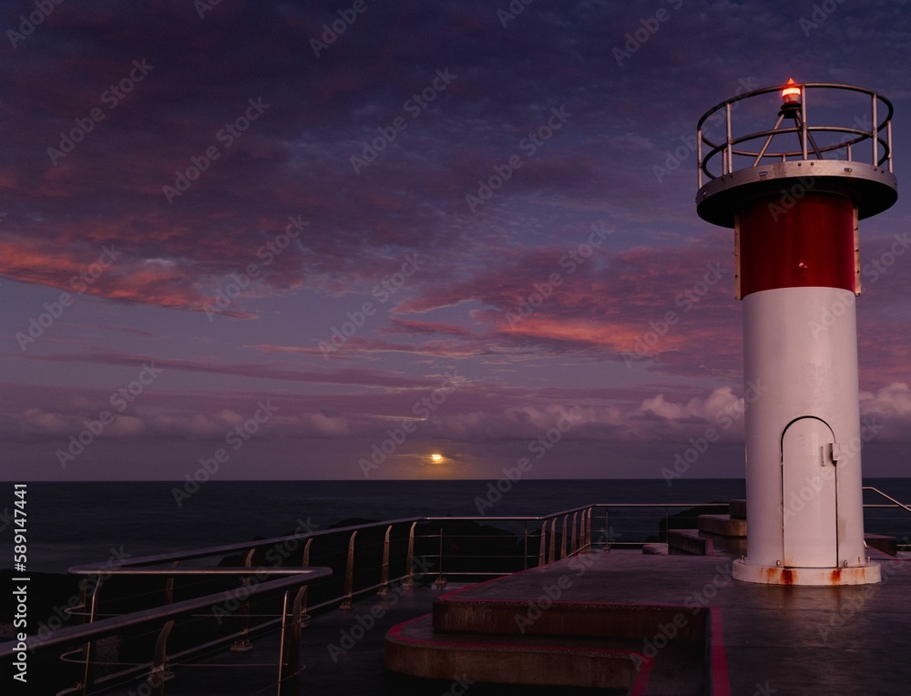 Naklejka premium Moonrise, seen from a small lighthouse on the northern tip of the Gold Coast in Queensland,Australia