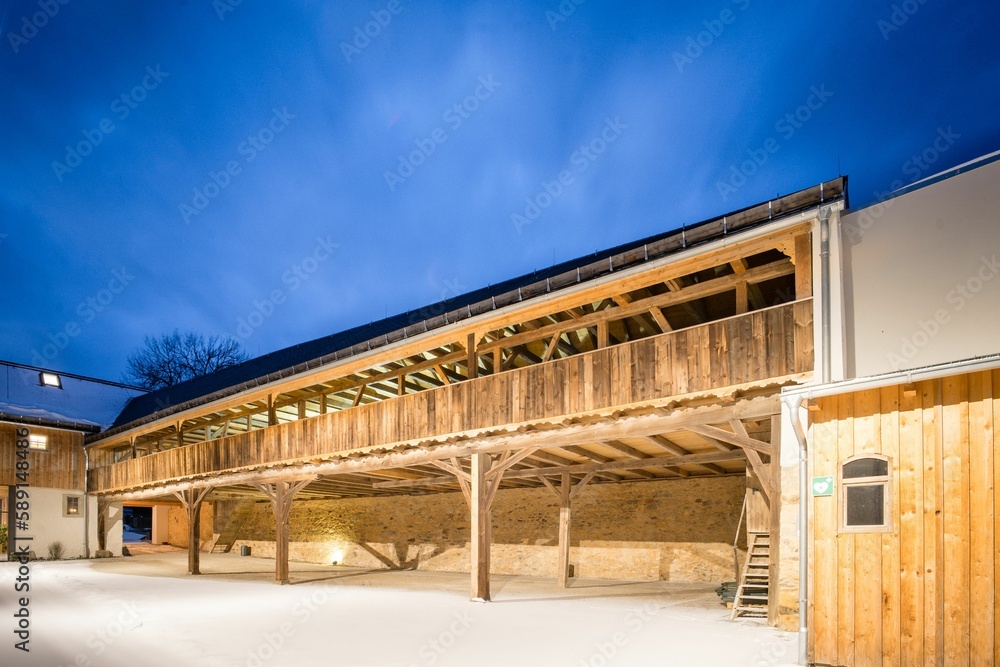 Beautifully renovated old farm with half-timbering in the evening Beautifully renovated old farm with half-timbering in the evening