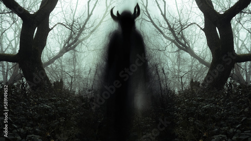 Foto A  blurred ghostly figure appearing on a path, like a pagan spirit, in a spooky forest with trees silhouetted on a moody foggy winters day