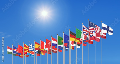 Flags of NATO - North Atlantic Treaty Organization and Finland.  - 3D illustration.  Isolated on sky background.