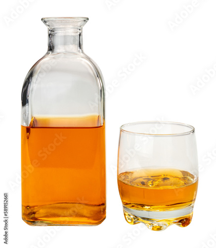 Glass bottle whiskey , or whisky or bourbon, near a glass of whiskey,  isolated