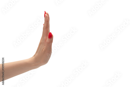 Woman hand with red nails holding something.