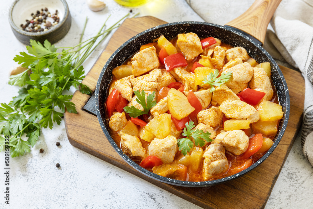 Stir-fried Taiwanese sliced Chicken breast with pineapple and pepper bell. Homemade delicious food in Taiwan on a stone tabletop. Stir-fried Taiwanese sliced Chicken breast with pineapple and pepper bell. Homemade delicious food in Taiwan on a stone tabletop.