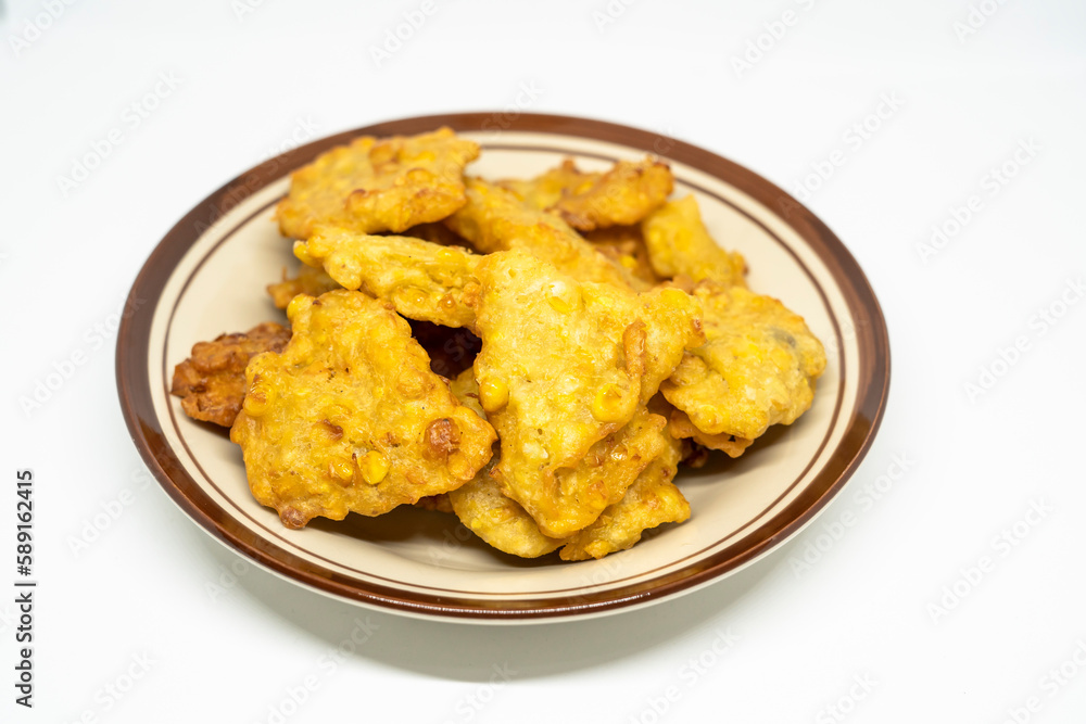 Perkedel Jagung or Bakwan Jagung, corn fritters is Indonesian traditional food. Perkedel Jagung or Bakwan Jagung, corn fritters is Indonesian traditional food.