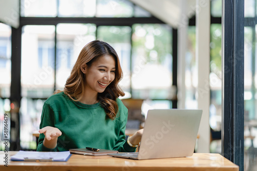 young woman working in a cafe using laptop and drinking coffee Asian female student using a computer for distance learning sitting on a bench in the shop casual lifestyle people and technology lifesty Free Download young woman working in a cafe using laptop and drinking coffee Asian female student using a computer for distance learning sitting on a bench in the shop casual lifestyle people and technology lifesty - GFXLoad