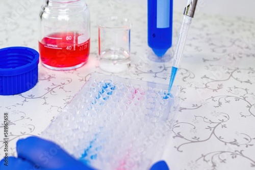 Scientist doctor pipetting samples in the lab