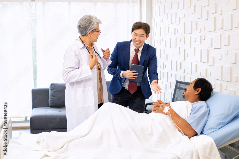 Hospital treatment room relative visit patient lay on bed doctor explain update illness condition Hospital treatment room relative visit patient lay on bed doctor explain update illness condition