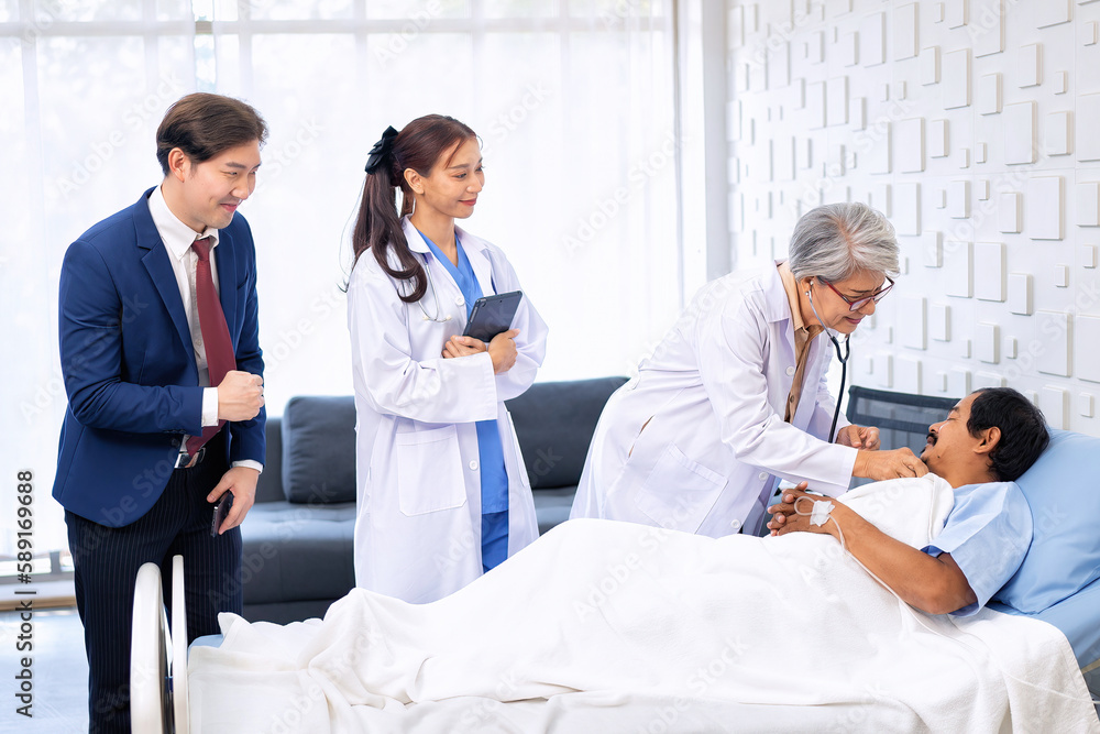 Hospital treatment room relative visit patient lay on bed doctor use stethoscope measurement Hospital treatment room relative visit patient lay on bed doctor use stethoscope measurement