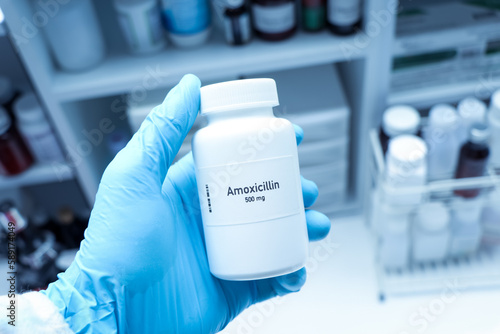 Amoxicillin pill in white bottle, pill stock photo