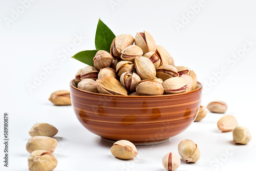 Pistachio in bowl on white background