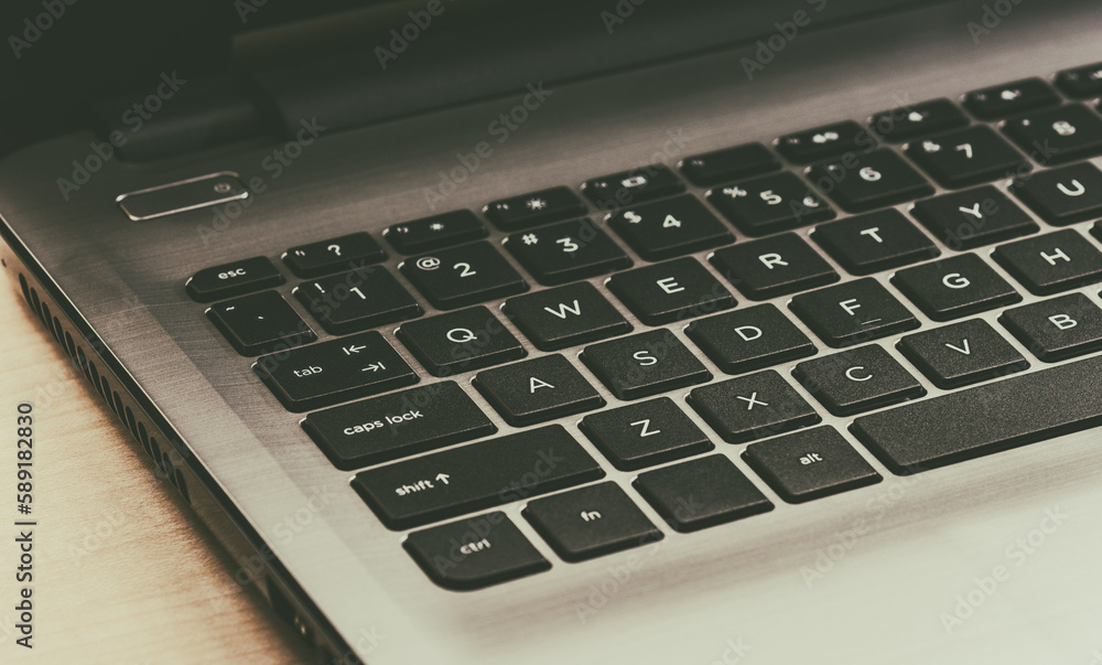 Laptop computer on wooden background