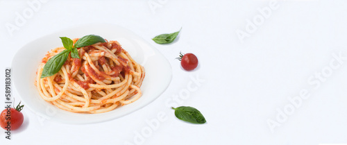 Italian pasta with tomato sauce and parmesan in the plate on the white background. Copy space. Close-up.