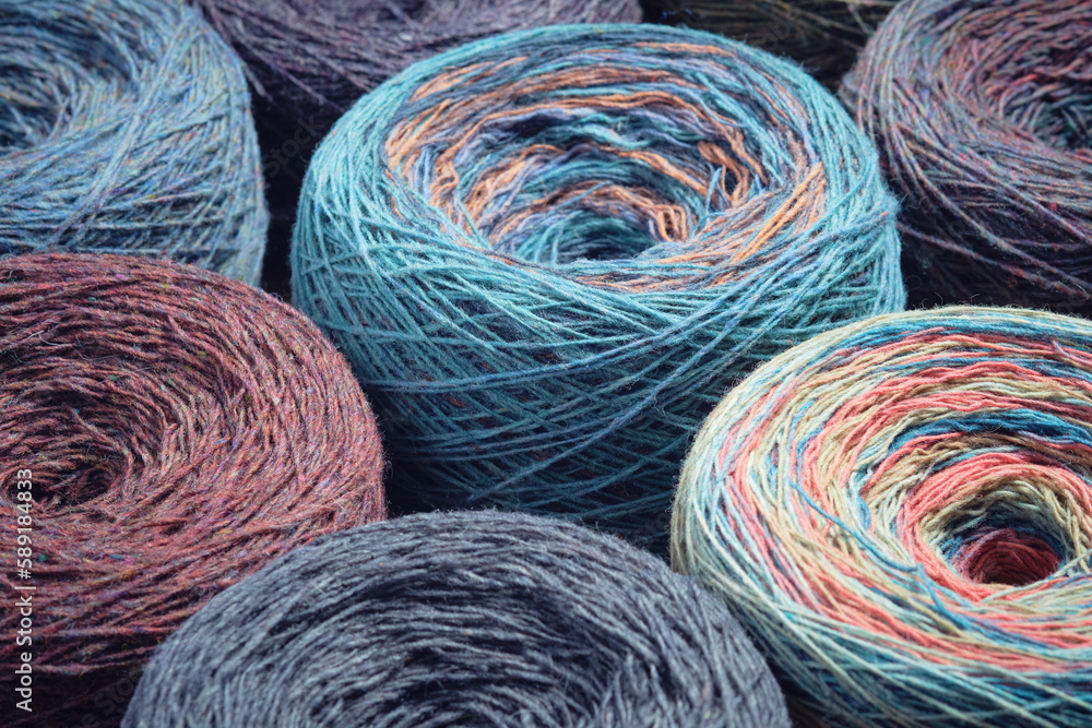 Round skeins of organic multi-coloured lambswool yarn. Round skeins of organic multi-coloured lambswool yarn.