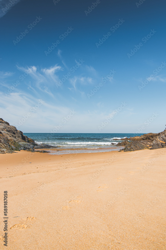 Walk along the Atlantic Ocean on the beach called Praia da Ilha do Pessegueiro near Porto Covo, western Portugal. Steps over Rota Vicentina