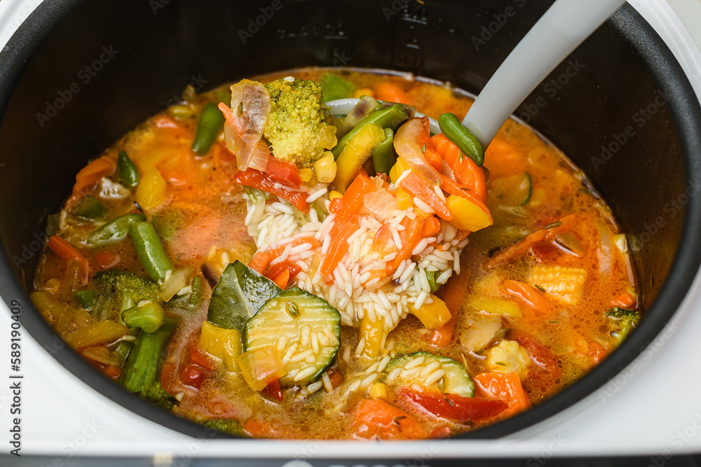 Cooking vegetable risotto in a saucepan. View from above. Cooking vegetable risotto in a saucepan. View from above.