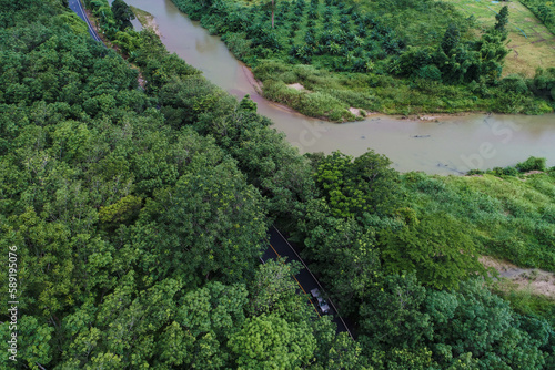 Aerial view asphalt road in tropical rain forest